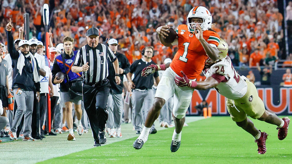 Miami Hurricanes wide receiver Malachi Toney (1) on a pass reception as Florida State Seminoles defensive back K.J. Kirkland (24) defends in the second half at Hard Rock Stadium in Miami Gardens, Florida, on Saturday, October 17, 2026.